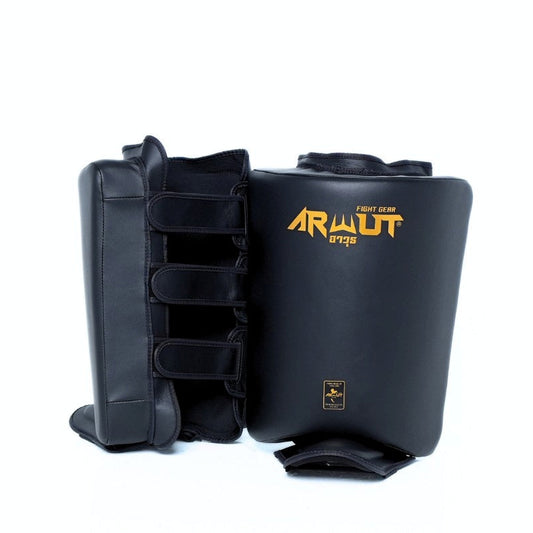 Black martial arts leg guards with 'ARWUT' branding on a white background