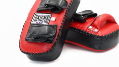 Red and black boxing mitts with a visible brand logo on a white background