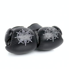 Black boxing gloves with a white emblem on a white background