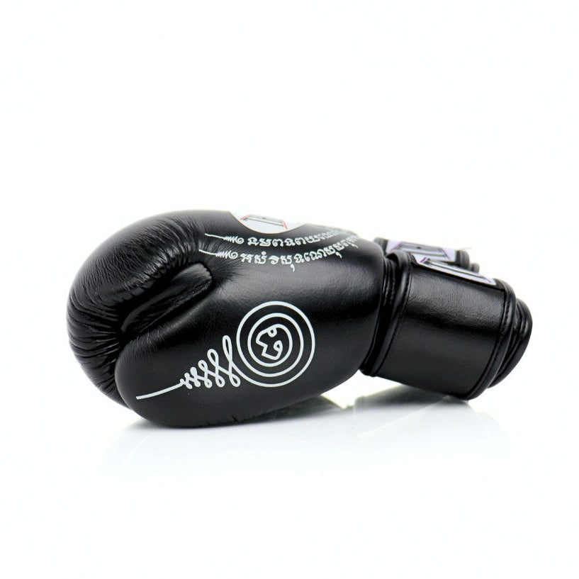 Black boxing glove with a white logo on a white background