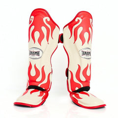 Red and white flame-patterned shin guards with 'Thaismai' branding on a white background
