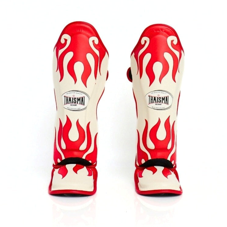 Red and white flame-patterned shin guards with 'Raisma' branding on a white background