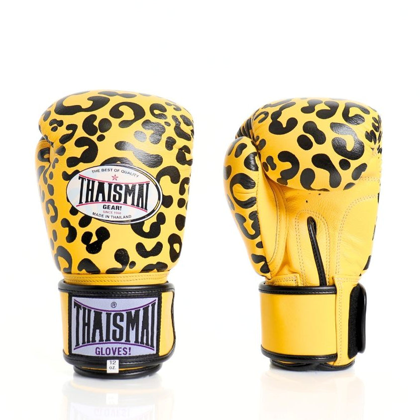 Yellow boxing gloves with black leopard print design on a white background