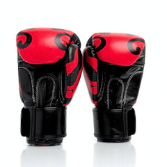Pair of red and black boxing gloves on a white background