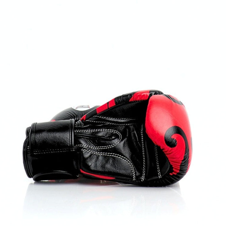 Black and red boxing glove on a white background