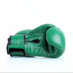 Green boxing glove on a white background