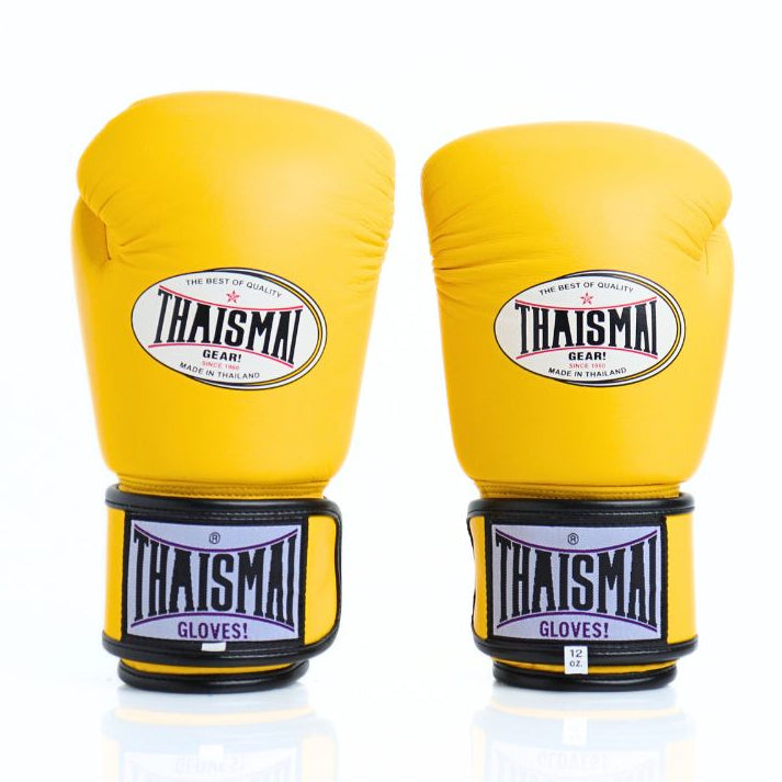 Yellow boxing gloves with Thaismai branding on a white background