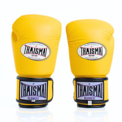 Yellow boxing gloves with Thaismai branding on a white background