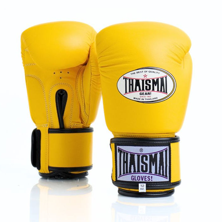 Yellow boxing gloves with Thaisma branding on a white background
