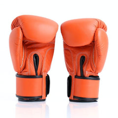 Pair of orange boxing gloves on a white background