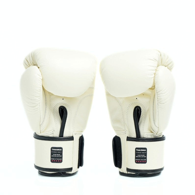 Pair of white boxing gloves with black accents on a white background