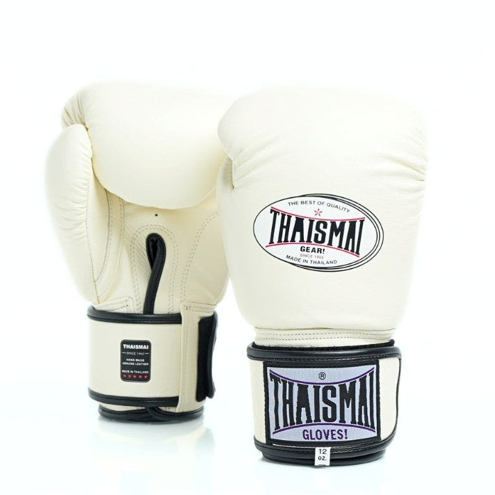 Pair of white boxing gloves with black accents and Thaisma branding on a white background