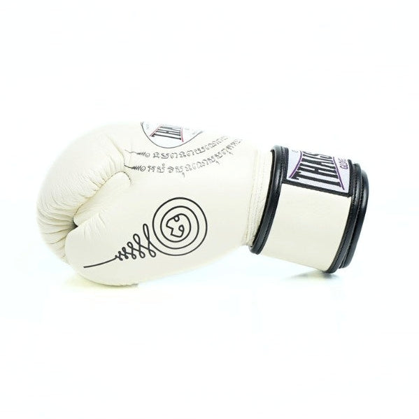 Pair of white boxing gloves with black accents on a white background