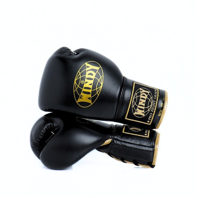 Black boxing glove with gold logo on a white background