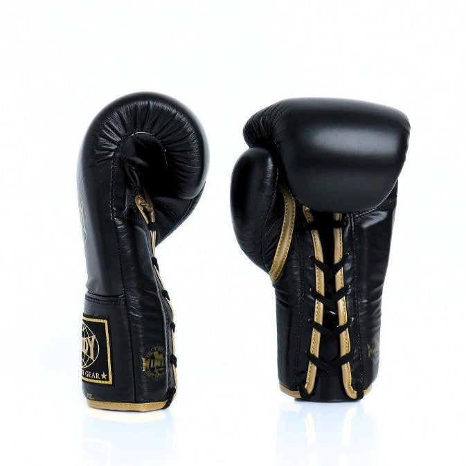 Pair of black boxing gloves with gold accents on a white background