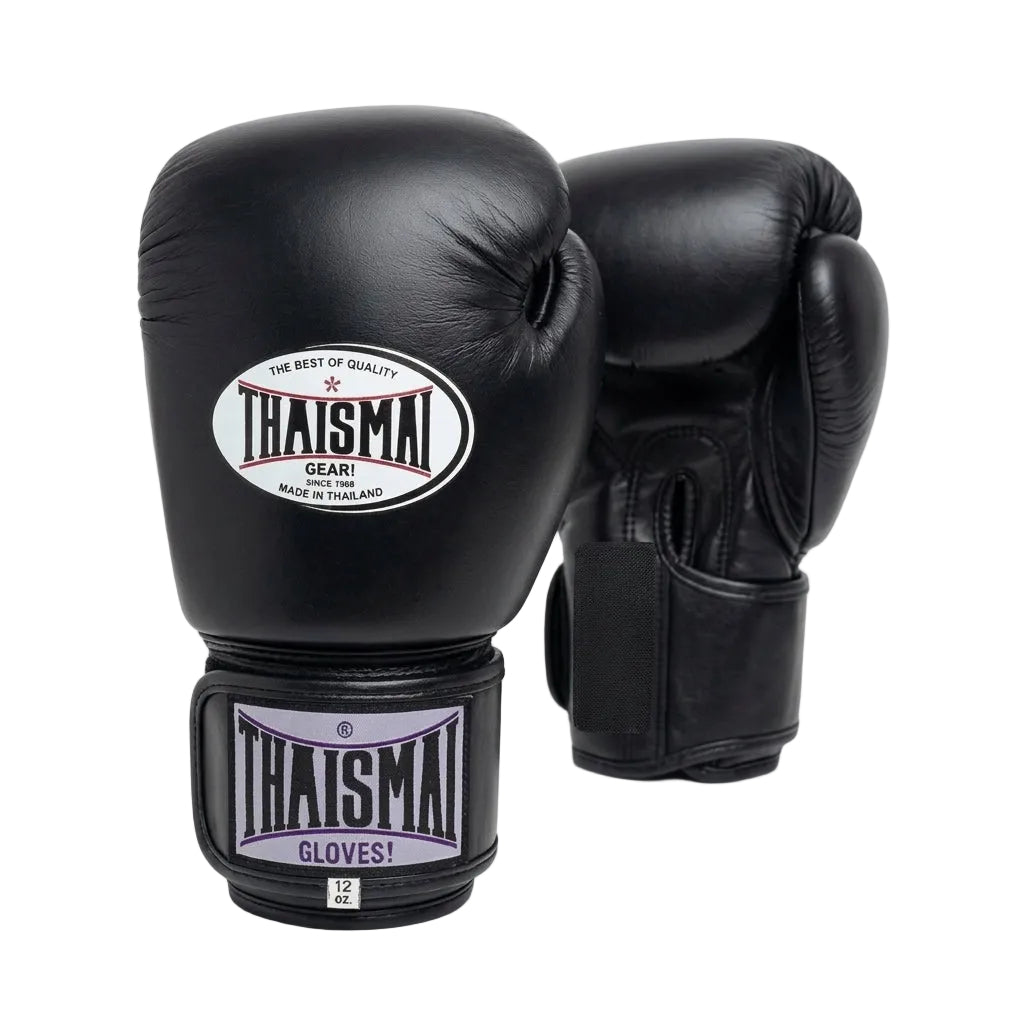 A pair of black leather boxing gloves with Thaismai branding, displayed on a clean white background.